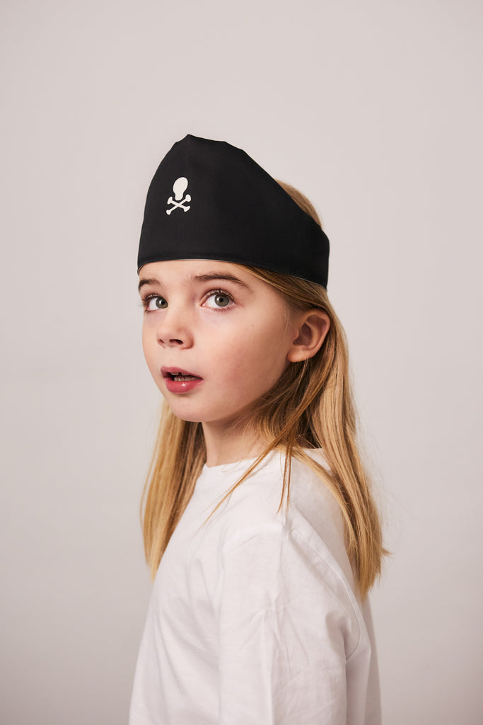 Boy with black cotton pirate's play hat