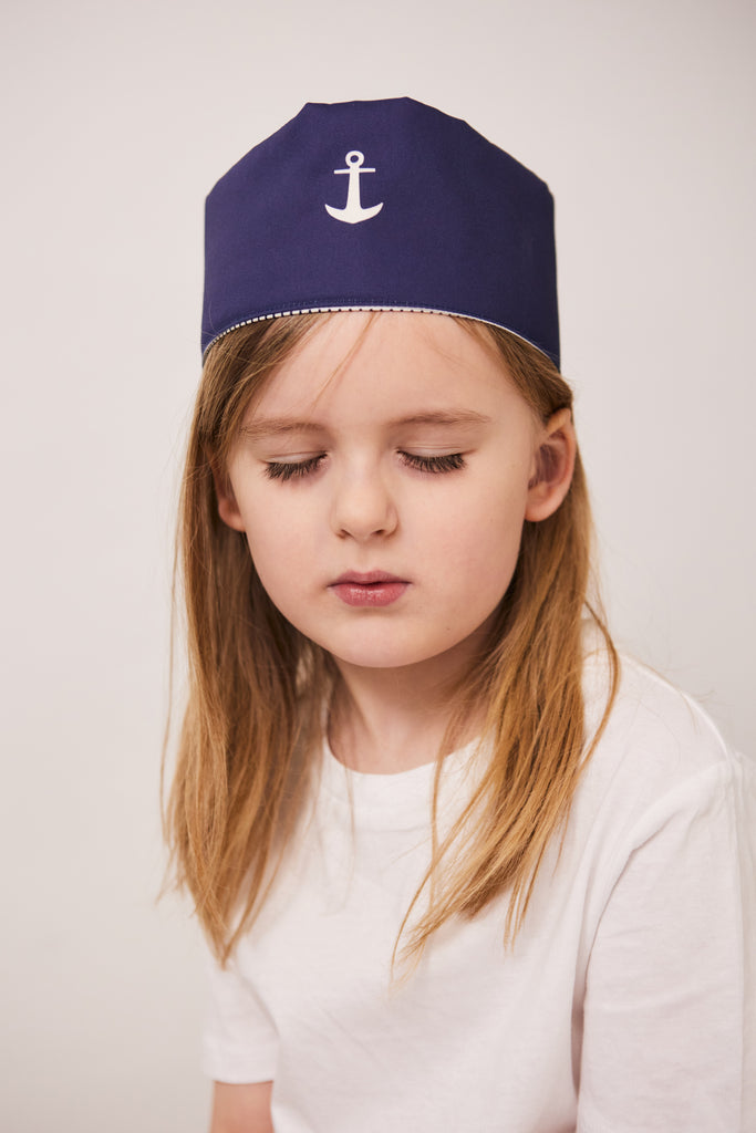 Boy with blue sailor's play hat